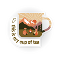 Sticker illustration of a mug with a scenic design and text 'this is my cup of tea' on a white background